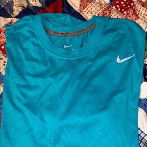 Turquoise Nike shirt.